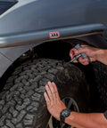 Man using Speedy Seal 2 Universal Heavy Duty Tire Repair Kit For Car, Truck, RV, Jeep, ATV, Motorcycle, Tractor And Trailer.