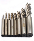 Close-up of 8-piece HSS end mill bit set with straight 4-flute cutters, sizes 1/16–1/2 in
