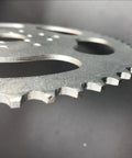 Close-up of High Performance 56 Tooth Chain Sprocket with Three Hole Six Hole Nine Pattern for 415 and 415H Chain on Gas Motorized Bicycle