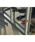 18V Connected Ready Two In One Impact Driver And Socket Wrench Kit in use on a metal frame