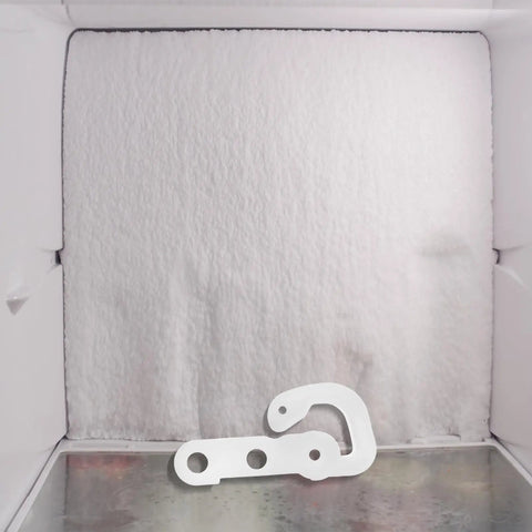 Premium White Refrigerator Door Stopper Replaces Latch Hook And Hinge Catch Clip For Smooth Appliance Operation With Streamlined Compact Fit To Prevent Freezer Swing displayed inside a freezer.