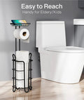 Black Free Standing Toilet Paper Holder With Shelf 2 Pack Dope Bathroom Storage Stand Holds One Roll On Arm And Two To Three Extra Rolls On Vertical Spindle beside toilet.