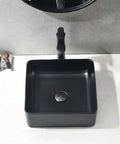 Sleek Matte Black Rectangle Vessel Sink 14 By 14 Inch Above Counter Vanity With Porcelain Ceramic Low Water Absorption Acid Resistant Easy To Clean Surface Durable Modern Bathroom Vessel Sink With Black Pop Up Drain