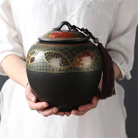 Slick Ceramic Airtight Storage Jar For Coffee Beans Sugar And Snacks Sleek Large Kitchen Container With Tight Seal Keeps Everything Crisp Down Home Vibes Total Game Changer held by hands with elegant design