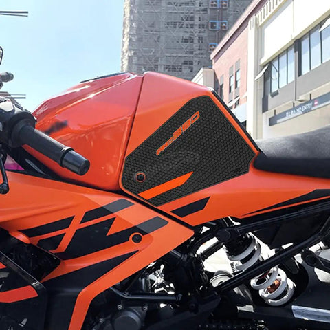 Tank Pad Protector Sticker For Motorcycle Gas Tank Knee Grip Traction Pad Side Protector Waterproof Non Slip Durable Easy Install Pattern Decal For 2017 2022 Bike Models on an orange motorcycle