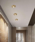 UWYTGF 6 Pack Led Can Lights Retrofit Recessed Lighting installed in a ceiling, featuring brass material and decorative trim.