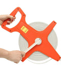 Open Reel Tape Measure With Retractable Blade, 300 Feet Dual Sided Tape For Track And Field, Long Jump, Construction, held with wind crank