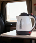 12V Car Electric Kettle With Auto Shut Off Portable Water Heater For Long Distance Runs And Weekend Getaways on table
