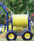Heavy Duty Garden Hose Reel Cart With Smooth Rolling Caster Wheels, Hella Durable Outdoor Water Storage Rack For Car Wash And Yard Cleanup, Industrial Vintage Style Holds 300 Feet shown on grass.