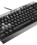 Goat Tier Compact Tenkeyless Mechanical Gaming Keyboard Featuring Cherry MX Red Switches For Hella Rapid Key Taps And A Clean Workstation Layout That Truly Slays During Marathon Sessions, angled view with black keys and metal frame.