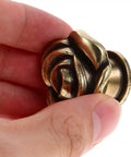 Hand holding Vintage Floral Cabinet Knobs 1.38 Inch Brass Retro Flower Drawer Pulls Handles For Dressers Wardrobes And Cabinets Set Of 2