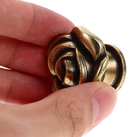 Hand holding Vintage Floral Cabinet Knobs 1.38 Inch Brass Retro Flower Drawer Pulls Handles For Dressers Wardrobes And Cabinets Set Of 2