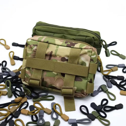 16 Pack Heavy Duty Zipper Pull Replacements For Luggage Backpacks Jackets And Purses Universal Zipper Tag Extender Repair Kit Built From Durable Nylon Cord With Wear Resistant Pull Tabs In Assorted Colors around camouflage and green bags.