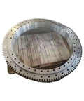 Rugged External Toothed Slewing Drive Assembly Featuring Precision Needle Bearings For Smooth Q Gear Steering Turntable Shaft Rotation on wooden pallet.