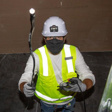 Worker using ET16 Borescope With 8mm Camera, 10-Foot Armored Gooseneck Endoscope, IP67 Waterproof, LED Lights in a dark space