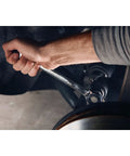 Hand using 7 Piece SAE Reversible Ratcheting Wrench Set With 72-Tooth Box End, 15 Degree Offset, Chrome Finish in tight space