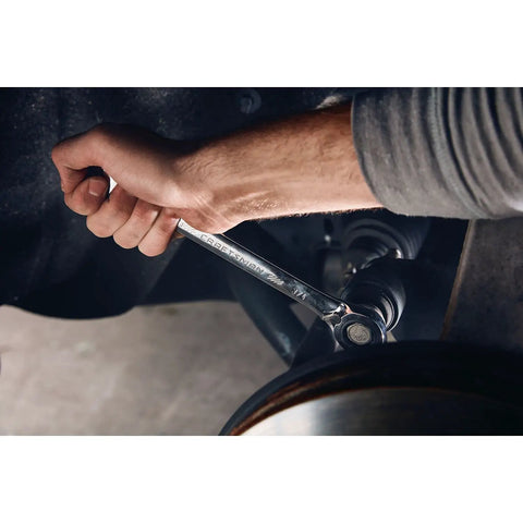 Hand using 7 Piece SAE Reversible Ratcheting Wrench Set With 72-Tooth Box End, 15 Degree Offset, Chrome Finish in tight space