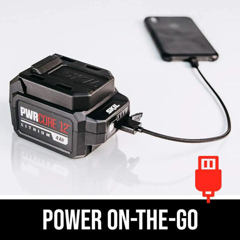 Badass Brushless 12V Cordless Drill And Five Half Inch Circular Saw Power Tool Combo Kit With Lithium Battery charging a phone.