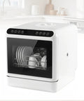 Compact Countertop Dishwasher Featuring A Built In Six Liter Water Reservoir And Swiveling Dual Spray Arms For Zero Hassle Plug And Play Setup Perfect For Tight Apartment Kitchens And Fast Air Drying with plates and cups visible.