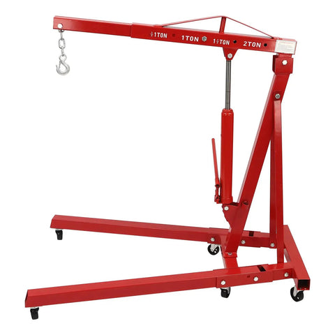 Heavy Duty Two Ton Folding Hydraulic Engine Hoist 4409 Pound Lift Cherry Picker Crane with red frame and adjustable arm.