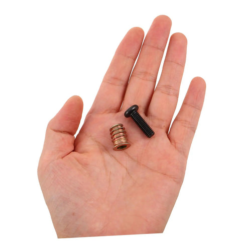 Hand holding components from Wood Furniture Threaded Inserts Kit With Bolts Nuts Wrenches And Drill Bit 50 Piece Metal Connector Hardware Set