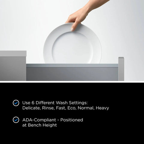 Hand placing a plate into the Series 7 Contemporary Single DishDrawer Countertop Dishwasher for cleaning.