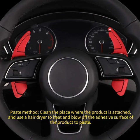 Close-up of Audi steering wheel with Two Piece Aluminum Alloy Shift Paddle Extensions For Audi A3 A4L 2013 2016 And A5 2012 2016 Bright Red Interior Accent Upgrade With CNC Machined Precision Fit And Non Slip Grip For A Sporty Driver Feel.