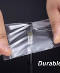 Hands holding 300 Clear Mini Plastic Baggies Two Point Two By Three Inch Reclosable Bags For Beads Jewelry Pills Screws Crafts