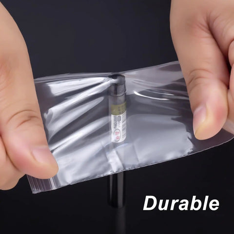 Hands holding 300 Clear Mini Plastic Baggies Two Point Two By Three Inch Reclosable Bags For Beads Jewelry Pills Screws Crafts
