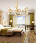 Modern Sputnik Chandelier 12 Light Gold Metal Ceiling Fixture for Living Room Bedroom Dining Kitchen and Office Dope Statement Lighting with E26 Base LED Compatible Bulbs Not Included 38.6 Inch Diameter in bedroom setting