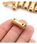 Heavy Duty Brass Flexible Shaft Coupler For Motor Transmission Connector And Rock Solid Drive Shaft Connections With 5mm Bore And M3 Mounting Bolts, held in hand.