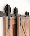 Heavy Duty Vintage Style Bypass Barn Door Hardware Kit for Double Doors, black top mounted tracks, smooth rolling rollers close-up