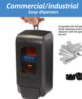 Hand using key from 15 Pcs Universal Paper Towel Dispenser Key Set With 3 Key Rings Replacement Keys for commercial dispenser