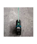 Heavy Duty Cordless Laser Level With Self Leveling Cross Line And Bright Green Beam For Construction Projects That Works Like A Charm Up To 115 Feet Range Paired With 12V CXT Battery System Tool Only on a concrete surface.
