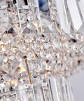 Close-up of Lit Modern Chrome Crystal Flush Mount LED Chandelier Light Fixture with sparkling crystal glass tubes and chrome finish.