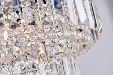 Close-up of Lit Modern Chrome Crystal Flush Mount LED Chandelier Light Fixture with sparkling crystal glass tubes and chrome finish.