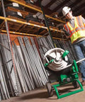 Electrician using Greenlee Classic W-Ranged Bending Shoe 555Rsc in warehouse, handling conduit bender tools.