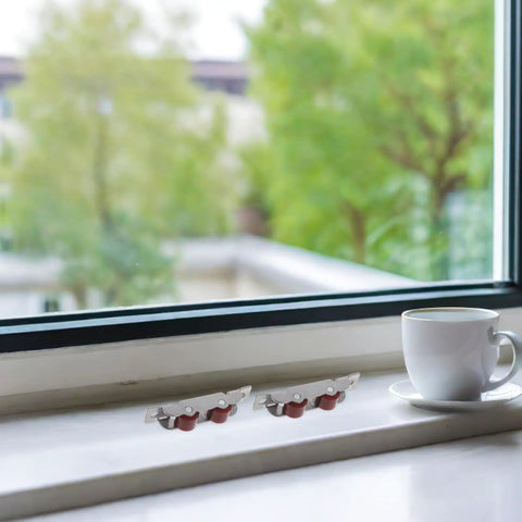 Top Tier Heavy Duty 4 Piece Stainless Steel Sliding Window Rollers With Double Wheel Bearing for smooth sleek motion near a window.