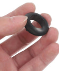 4 Pack Rubber Grommet Kit For Wires And Cables Heat Resistant Flexible Grommets For Strain Relief Wiring Hole Plugs Black DIY Friendly Pro Grade For Home And Industrial Projects, black rubber grommet held in hand
