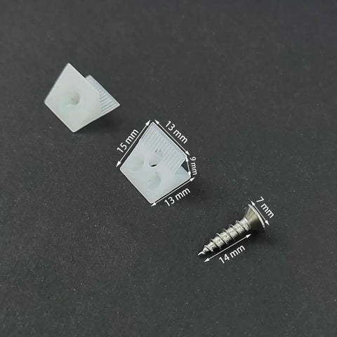 Close-up of plastic wedges and screws from 100 Piece Plastic Drawer Wedges With Screws Set For Sagging Drawer Bottom Repair