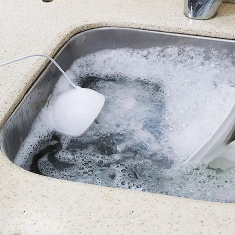 Slick Portable Usb Dishwasher With Ultrasonic Deep Clean And High Pressure Water Spray That Tackles Greasy Pots And Pans Hassle Free For Small Kitchens Apartments Or Rv Outings In Matte Blue in soapy water.