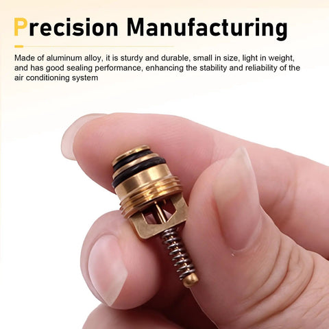 Close-up of a hand holding a brass valve core, part of the 17 Piece Car AC Valve Core Kit Pro Grade With R12 To R134a Conversion.
