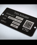 Black Trim Actuator nameplate with P/N MBKT02-1001A, MFR 4AW27, SERNO 4AW27 010, CTSi logo and QR code