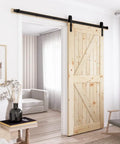 6 Ft Sliding Barn Door Hardware Kit With Black Track installed on wooden barn door, showing smooth quiet operation in a modern living room.
