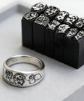 Chinese Zodiac Pattern Metal Stamping Set with steel stamps for jewelry, featuring rooster design on a ring and stamp blocks.