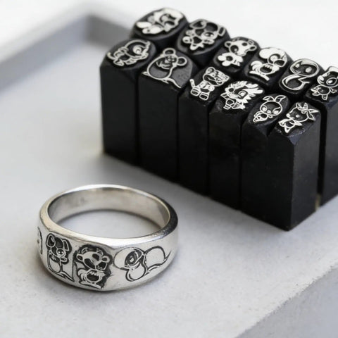 Chinese Zodiac Pattern Metal Stamping Set with steel stamps for jewelry, featuring rooster design on a ring and stamp blocks.