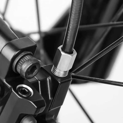 Top Tier Stainless Steel Brake Hose Fitting Bolts For Mountain Bike That Resist Rust And Provide Stable High Pressure Stopping Power So You Can Ride Hard Without Worrying About Safety Or Maintenance Hassles. close-up on bike brake hose fitting
