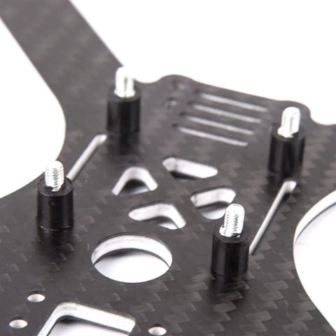 Close-up of carbon fiber frame with M3 Flight Controller AntiVibration Rubber Pillar Mount Kit 4 Piece Stud Bushing Set installed