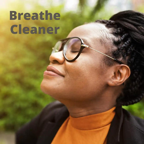 Person enjoying fresh air outdoors with "Breathe Cleaner" text, promoting MERV 8 Pleated Replacement Air Filter 14x18x1 for AC and Furnace.