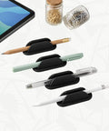 Adhesive Pencil Holder Kit Ten Pack for desk and wall with pencils and pens in black silicone holders for classroom use.